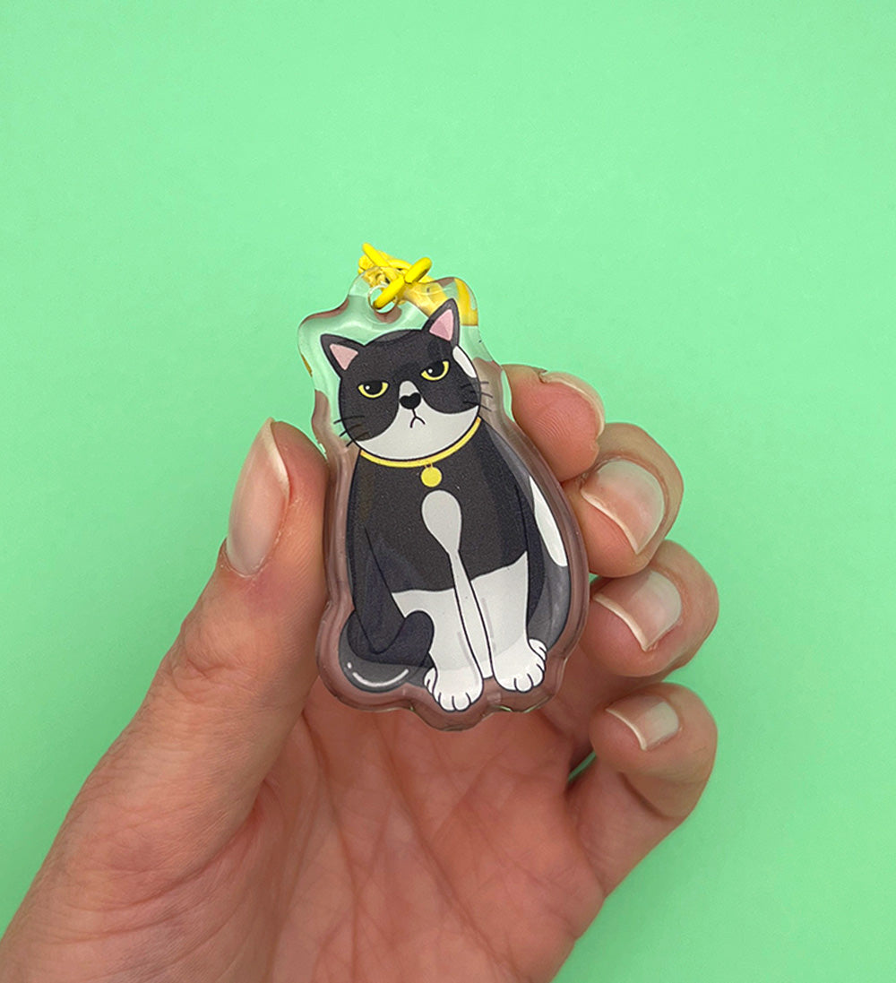 Porte-clés Chat Noir et blanc grincheux